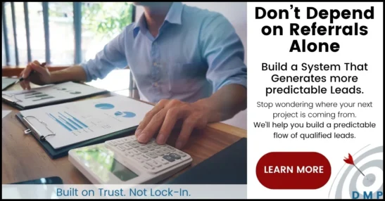 Contractor sitting at a desk reviewing business documents.