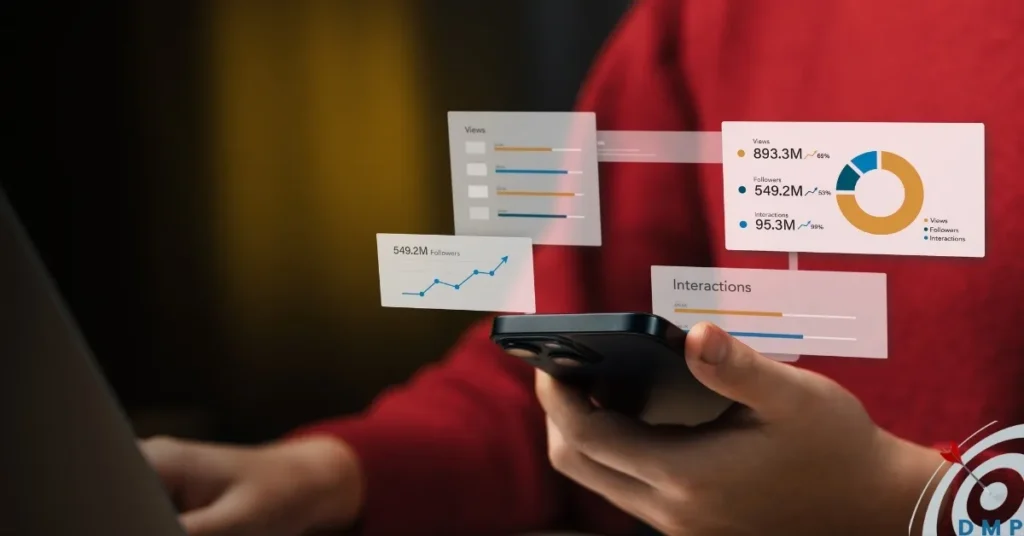 A person in a red top holding a smartphone with business graphs hovering.