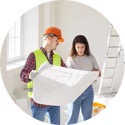 Contractor reviewing plans 250x250 Contractor reviewing project plans with a homeowner.